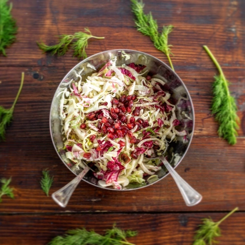 Green cabbage and pomegranate with dill mustard vinaigrette 